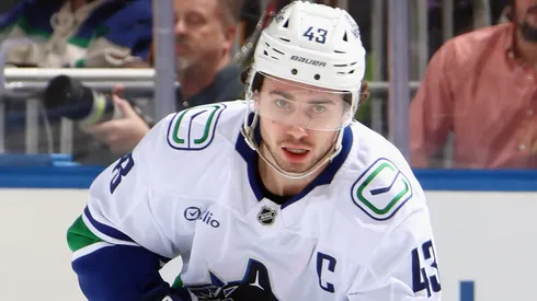 Quinn Hughes #43 of the Vancouver Canucks skates with the puck.