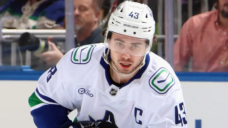 Quinn Hughes #43 of the Vancouver Canucks skates with the puck.