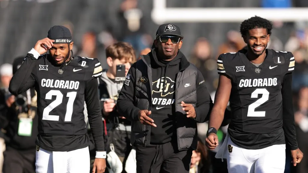 Shilo Sanders (left) with his father Deion (center) and brother Shedeur (right).