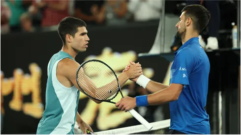 Novak Djokovic of Serbia (R) embraces Carlos Alcaraz of Spain