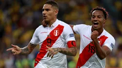 Paolo Guerrero of Peru celebrates a goal with teammate Andre Carrillo.