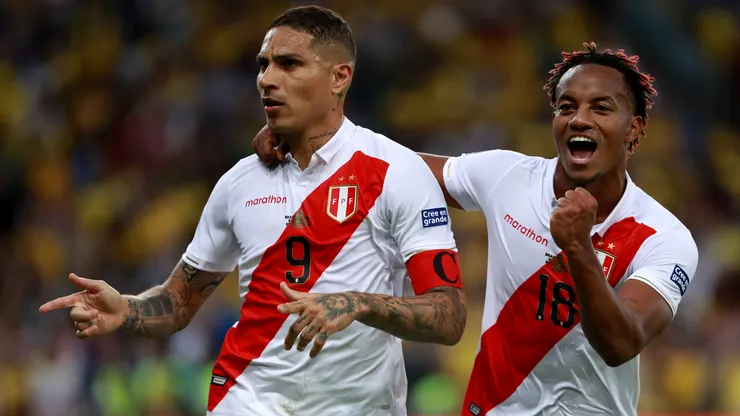 Paolo Guerrero of Peru celebrates a goal with teammate Andre Carrillo.