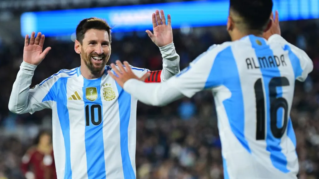Lionel Messi celebrates a goal against Venezuela with Thiago Almada. (Marcelo Endelli/Getty Images)
