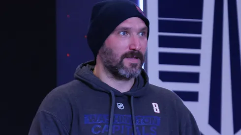 Alex Ovechkin holds a Bud Light prior to a press conference.