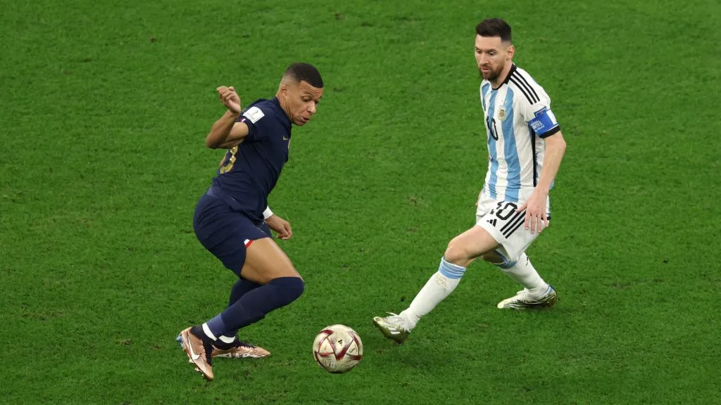 Kylian Mbappe of France with the ball against Lionel Messi of Argentina. (Richard Heathcote/Getty Images)