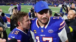 Matt Prater #15 and Josh Allen #17 of the Buffalo Bills embrace.
