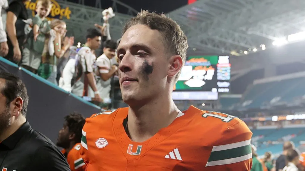 Carson Beck walking off the field