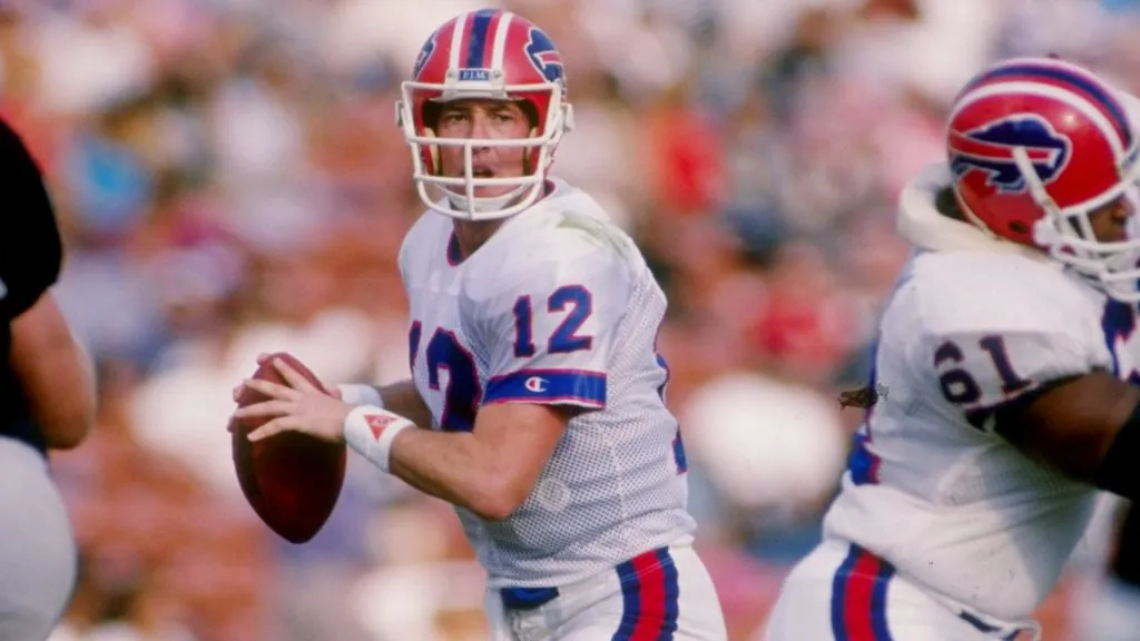 Jim Kelly of the Buffalo Bills prepares to pass the ball during a game against the Los Angeles Raiders in 1991. (Source: Getty Images)