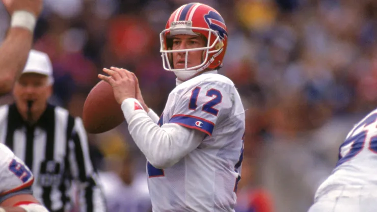Quarterback Jim Kelly #12 of the Buffalo Bills looks to pass during a game against the Los Angeles Raiders in 1991.