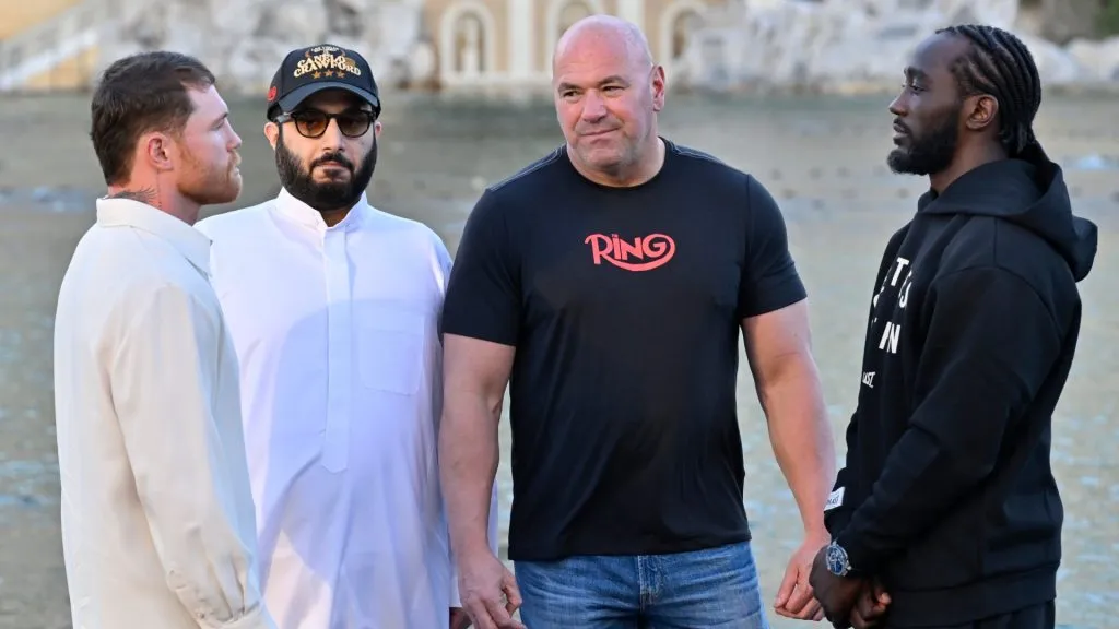 Canelo Alvarez and Terence Crawford face off as Turki Al-Sheikh and Dana White look. (Photo by David Becker/Getty Images for Netflix)