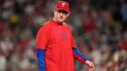 Rob Thomson #49 of the Philadelphia Phillies walks to the dugout.