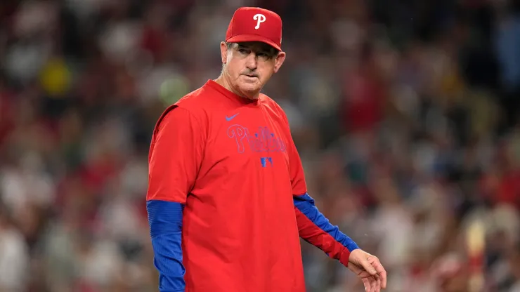 Rob Thomson #49 of the Philadelphia Phillies walks to the dugout.