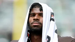 Shedeur Sanders watching from the sideline.