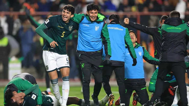 Efraín Morales of Bolivia and teammates celebrate after winning.