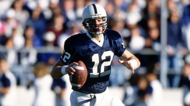Kerry Collins rolls out of the pocket while looking for an open receiver in 1994.