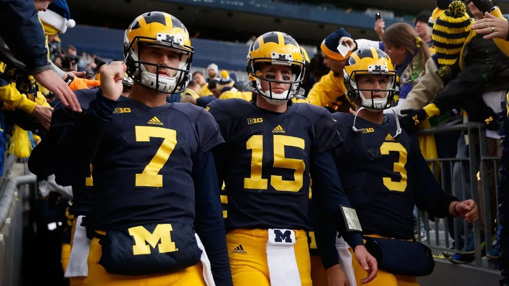 Michigan Wolverines players take the field for warm ups to a college football game in 2015. (Source: Christian Petersen/Getty Images)