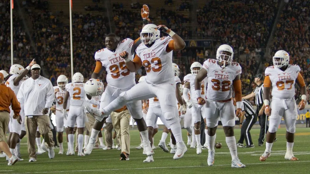 Paul Boyette Jr. and Poona Ford #95 of the Texas Longhorns celebrate in 2016. (Source: Brian Bahr/Getty Images)
