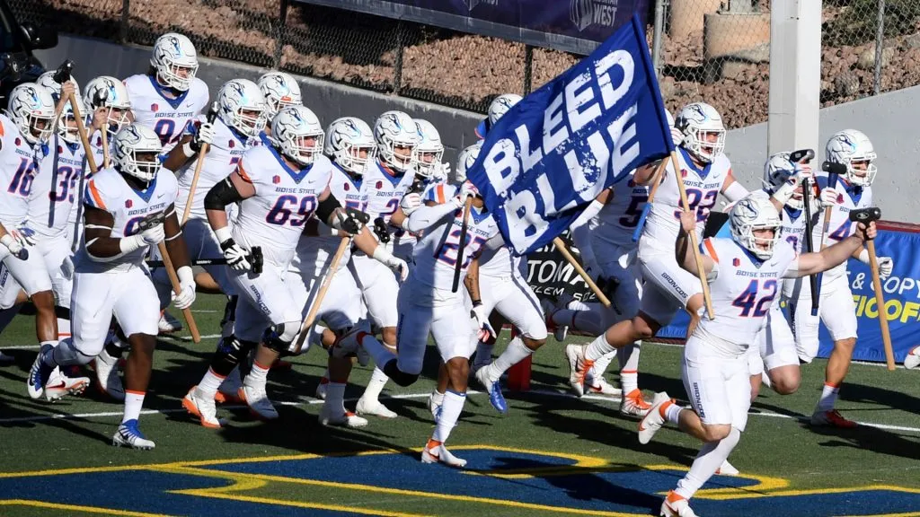 Long snapper Daniel Cantrell #42 of the Boise State Broncos carries a flag in 2020. (Source: Ethan Miller/Getty Images)