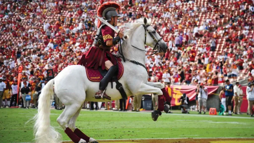 Traveler and Tommy trojan (Source: USC Today – University of Southern Califoria)