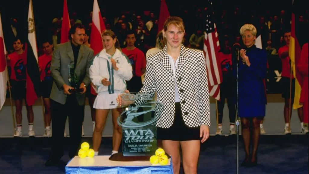 Steffi Graf poses with a trophy after defeating Anke Huber. (Al Bello/Allsport/Getty Images)