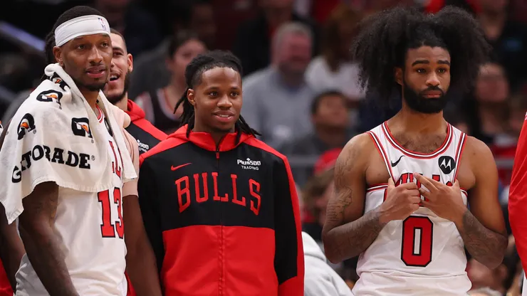 Torrey Craig #13, DJ Steward #00, Coby White #0 of the Chicago Bulls look on.