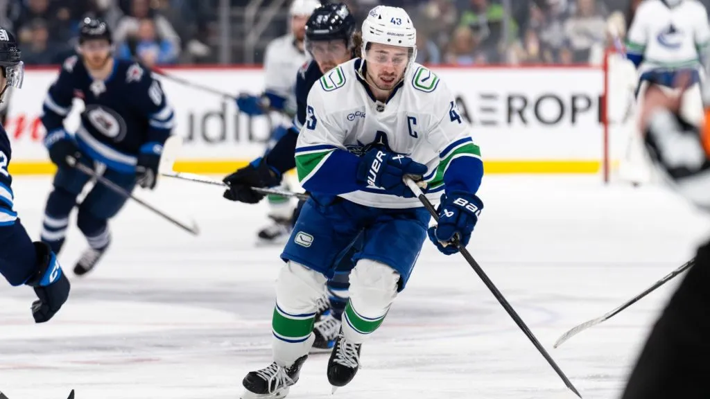 Quinn Hughes #43 of the Vancouver Canucks skates with the puck. (Photo by Cameron Bartlett/Getty Images)