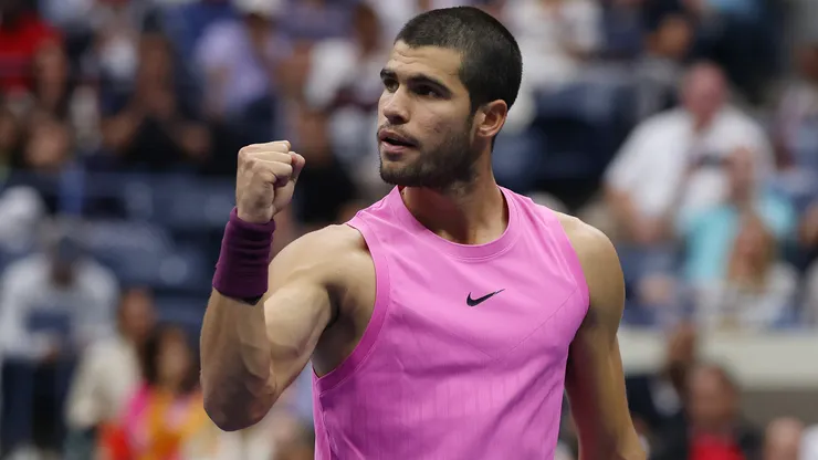 Carlos Alcaraz celebrates a point against Jannik Sinner.