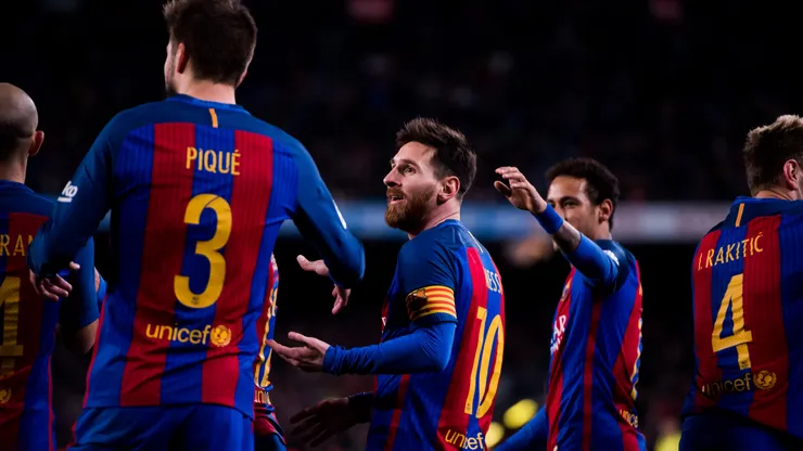 Lionel Messi of Barcelona celebrates a goal with teammates.