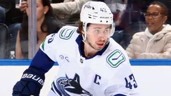 Quinn Hughes in action for the Vancouver Canucks during the 2024-25 NHL season.
