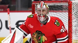 Spencer Knight #30 of the Chicago Blackhawks warms up prior to the game.