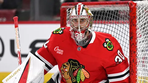 Spencer Knight #30 of the Chicago Blackhawks warms up prior to the game.