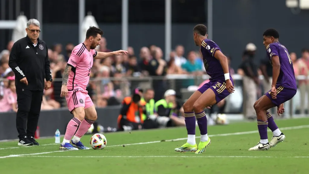 Lionel Messi plays against Orlando City as Gerardo Martino watchs from the sideline. (Megan Briggs/Getty Images)