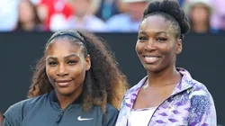 Venus Williams and Serena Williams pose for a photo prior to a game.