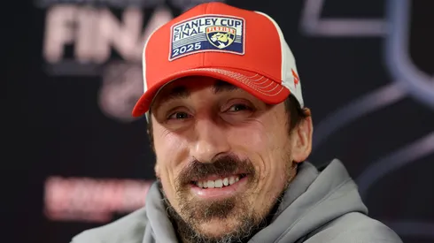 Brad Marchand smiling at a press conference.