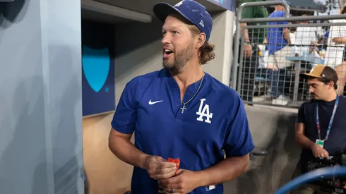 Clayton Kershaw #22 of the Los Angeles Dodgers walks in the dugout.