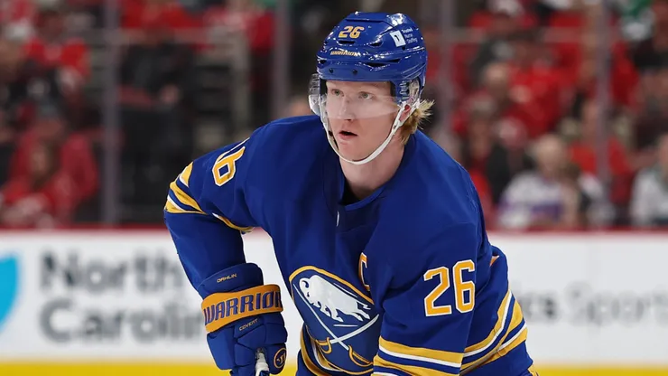 Rasmus Dahlin #26 of the Buffalo Sabres skates with the puck.