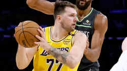 Luka Doncic #77 of the Los Angeles Lakers looks to pass the ball in an NBA game.