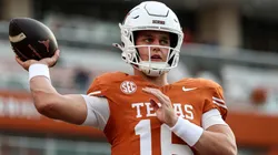 Arch Manning #16 of the Texas Longhorns warms up.