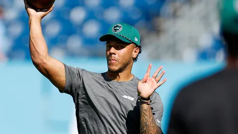 Quarterback Adrian Martinez warms up prior to a game.