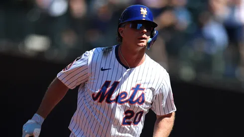 Pete Alonso #20 of the New York Mets reacts to a home run.