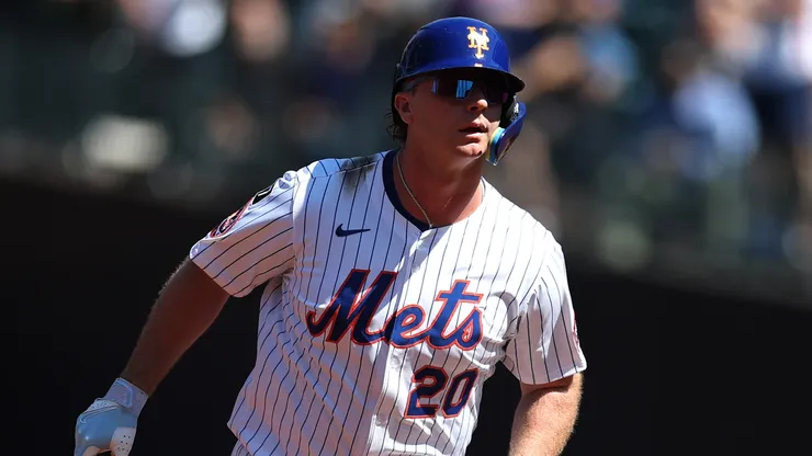 Pete Alonso #20 of the New York Mets reacts to a home run.