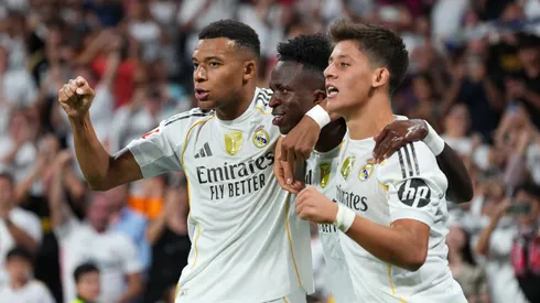 Vinicius Junior of Real Madrid celebrates scoring his team's second goal with teammate Kylian Mbappe.