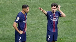 Vitinha #17 and Achraf Hakimi #2 of Paris Saint-Germain prepare for the free kick.