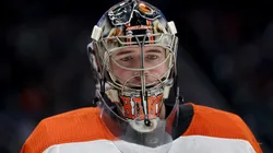 Carter Hart looks on during an NHL game.