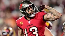 Mike Evans #13 of the Tampa Bay Buccaneers celebrates after scoring a touchdown.