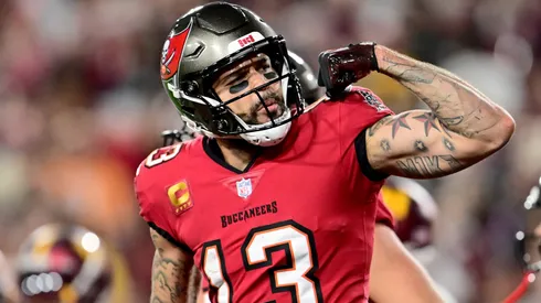 Mike Evans #13 of the Tampa Bay Buccaneers celebrates after scoring a touchdown.