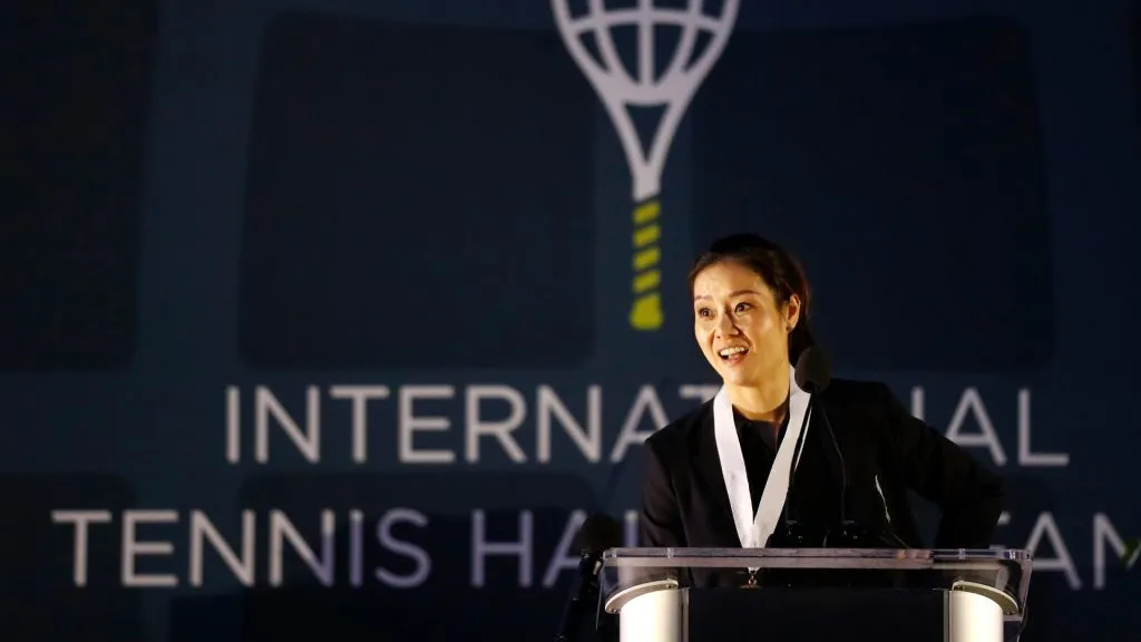 Li Na gives her speech after being inducted to the International Tennis Hall of Fame. (Omar Rawlings/Getty Images)