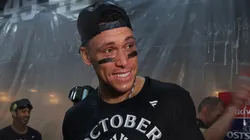Aaron Judge #99 of the New York Yankees celebrates in the locker room after the New York Yankees clinched a playoff spot.