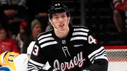 Luke Hughes #43 of the New Jersey Devils skates in an NHL game.