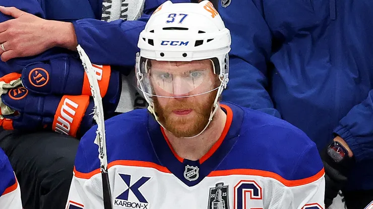 Connor McDavid (#97) looks on from the Oilers bench during NHL action.